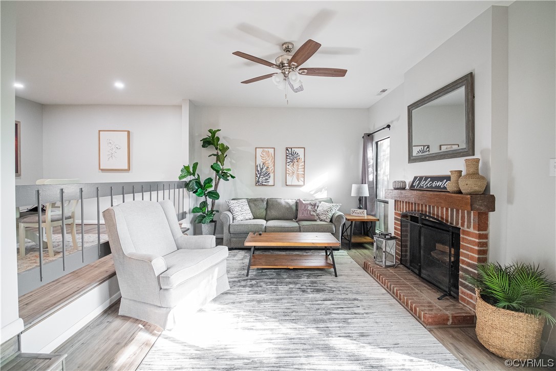 11601 East Briar Patch Drive Midlothian, VA 23113 - Photo 26 of 50 a living room with furniture and a fireplace