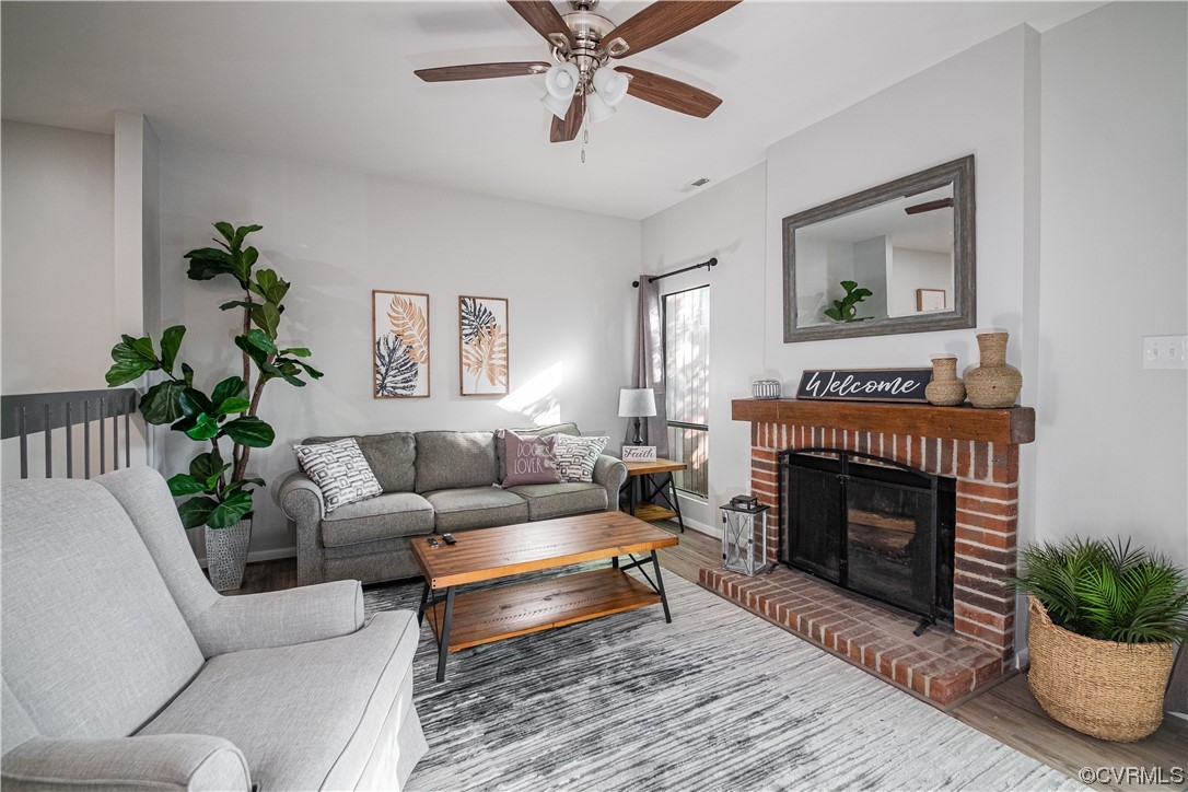 11601 East Briar Patch Drive Midlothian, VA 23113 - Photo 27 of 50 a living room with furniture and a fireplace