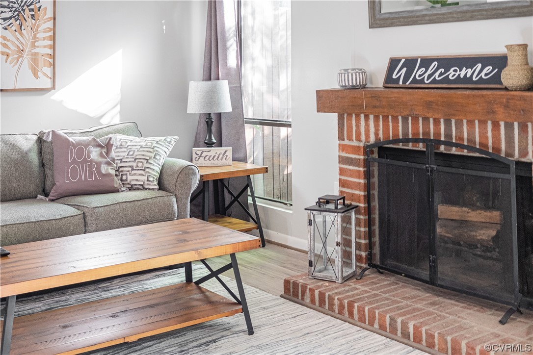 11601 East Briar Patch Drive Midlothian, VA 23113 - Photo 28 of 50 a living room with furniture and a fireplace