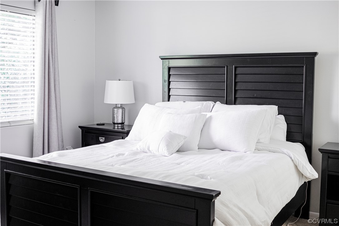 11601 East Briar Patch Drive Midlothian, VA 23113 - Photo 33 of 50 a bedroom with a bed and a lamp