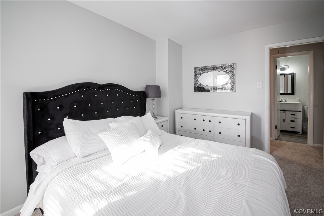 11601 East Briar Patch Drive Midlothian, VA 23113 - Photo 39 of 50 a bedroom with a bed and a large mirror