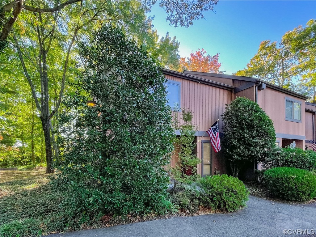 11601 East Briar Patch Drive Midlothian, VA 23113 - Photo 4 of 50 front view of a house with a tree