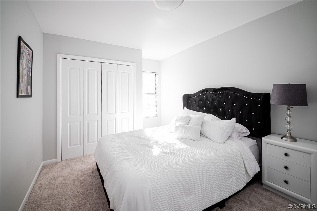 11601 East Briar Patch Drive Midlothian, VA 23113 - Photo 42 of 50 a bedroom with a bed and lamp