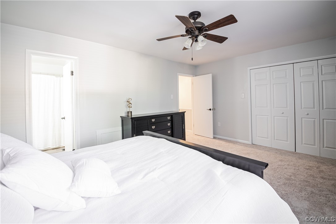 11601 East Briar Patch Drive Midlothian, VA 23113 - Photo 43 of 50 a bedroom with a large bed and a chandelier