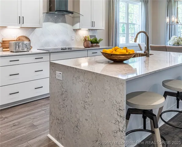 a kitchen with stainless steel appliances a sink and a stove