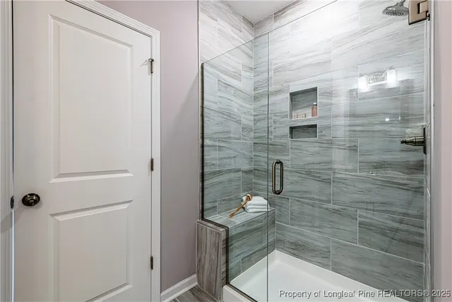a bathroom with a shower and toilet