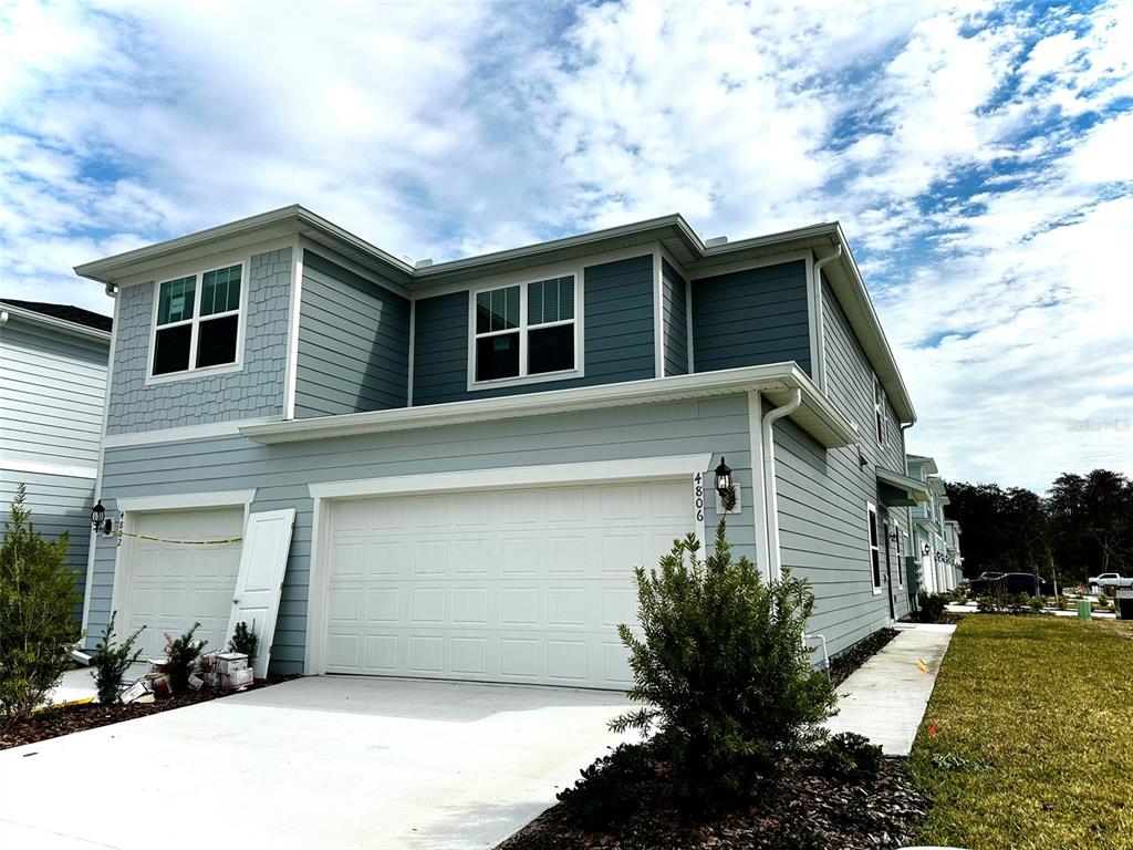 a house view with a backyard space