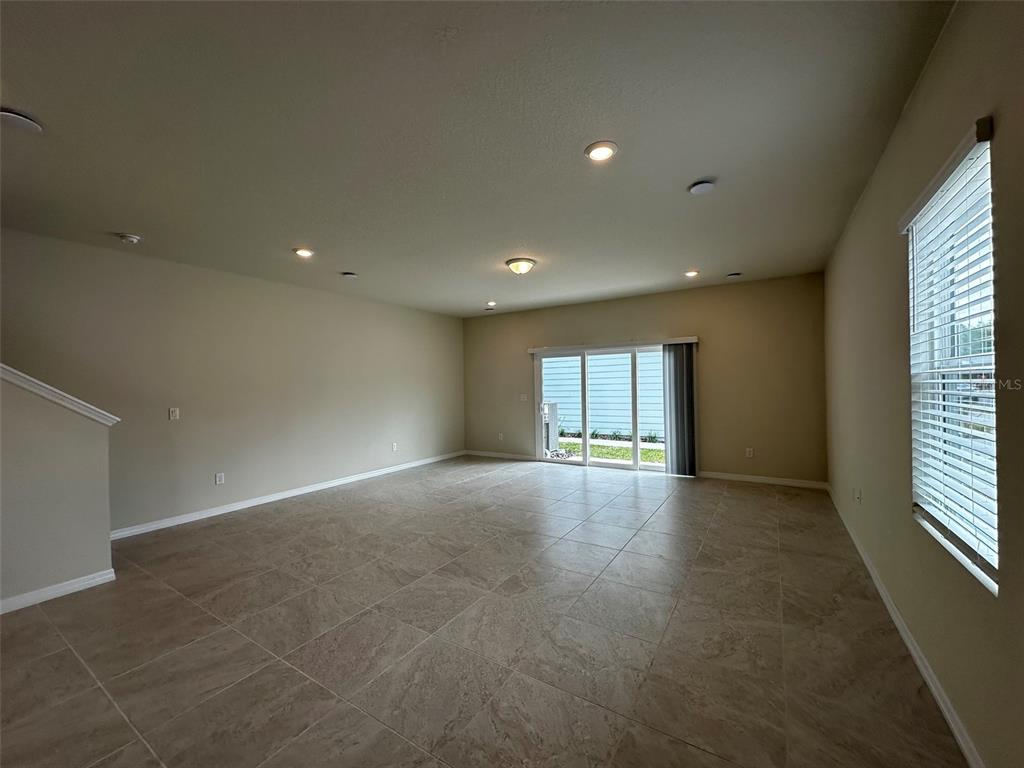 4806 Sparkling Shell Avenue Kissimmee, FL 34746 - Photo 4 of 19 a view of empty room with windows