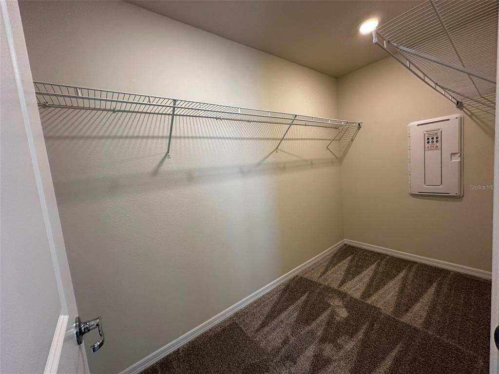4806 Sparkling Shell Avenue Kissimmee, FL 34746 - Photo 10 of 19 a view of a room with racks on the wall