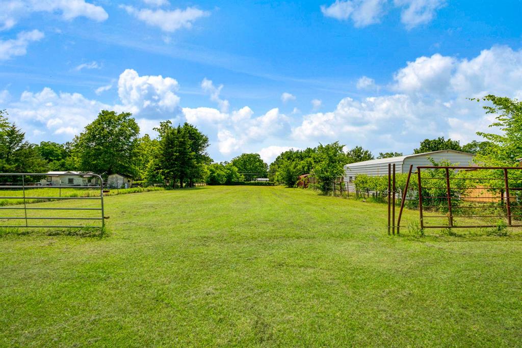 735 1st Southwest Detroit, TX 75436 - Photo 17 of 26 a view of a golf course with a lake view