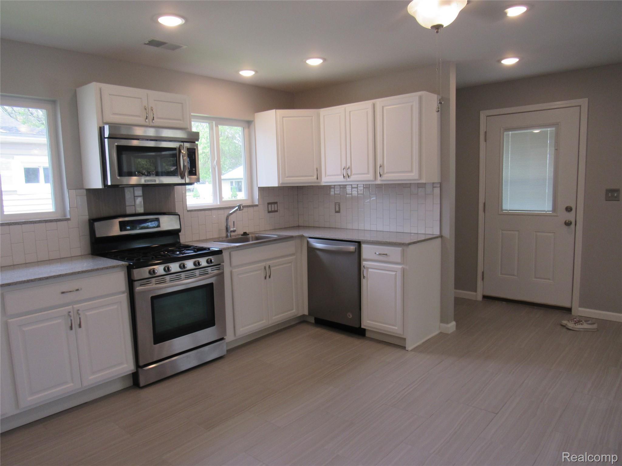 6764 Harding Street Taylor, MI 48180 - Photo 8 of 37 New Cabinets with Granite counter tops and beautifully tiled back splash!