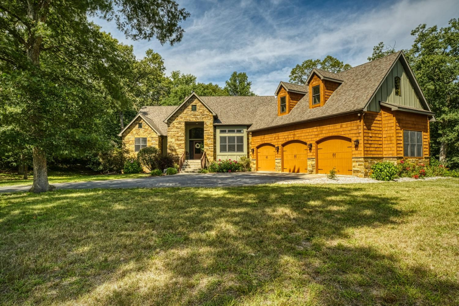 8468 Old Oak Drive Demotte, IN 46310 - Photo 1 of 35 a front view of a house with garden