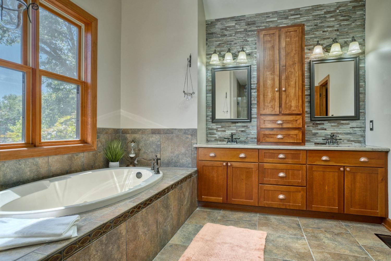 8468 Old Oak Drive Demotte, IN 46310 - Photo 11 of 35 a bathroom with a granite countertop tub sink and mirror