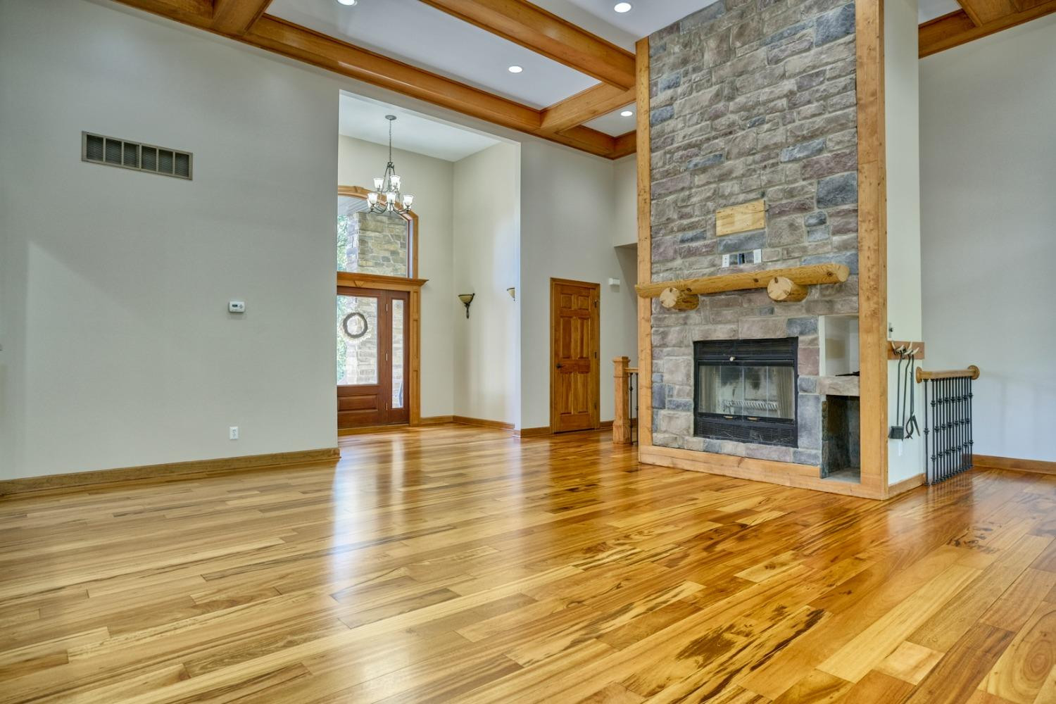8468 Old Oak Drive Demotte, IN 46310 - Photo 3 of 35 an empty room with wooden floor and fireplace