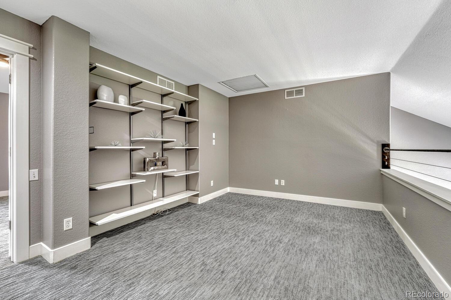 6335 Trailhead Road Highlands Ranch, CO 80130 - Photo 24 of 50 a view of a room with rack on the wall