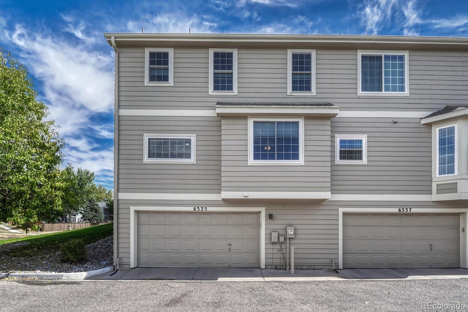 6335 Trailhead Road Highlands Ranch, CO 80130 - Photo 36 of 50 a view of a house with a garage