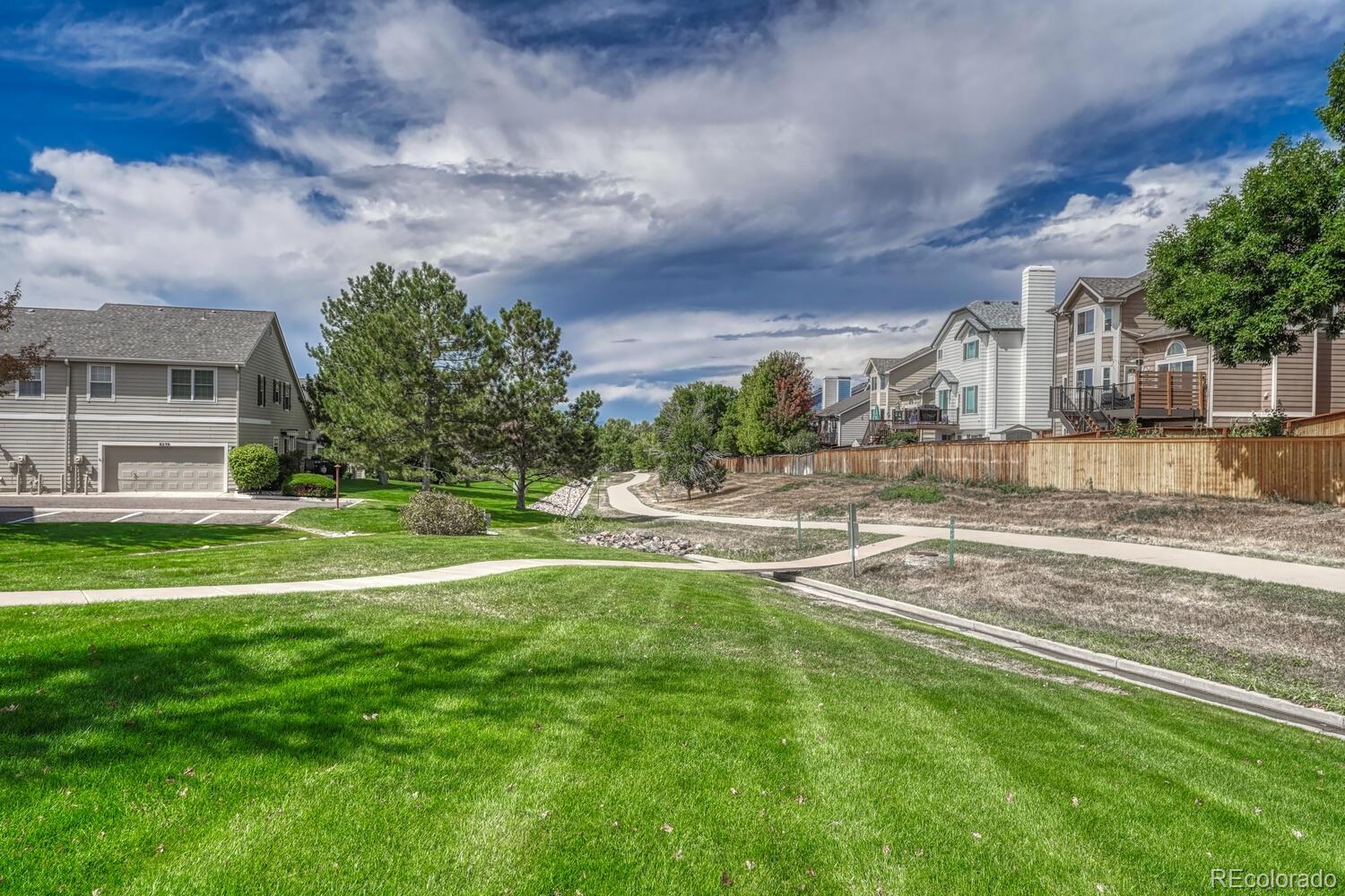 6335 Trailhead Road Highlands Ranch, CO 80130 - Photo 40 of 50 a view of a fountain in front of a house