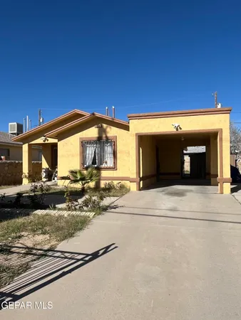 a view of a house with a street