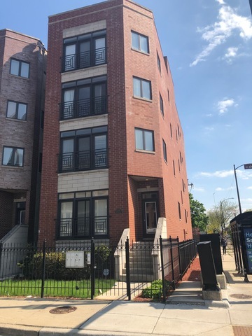 2355 West Harrison Street, Unit GDN Chicago, IL 60612 - Photo 1 of 14 a front view of a building