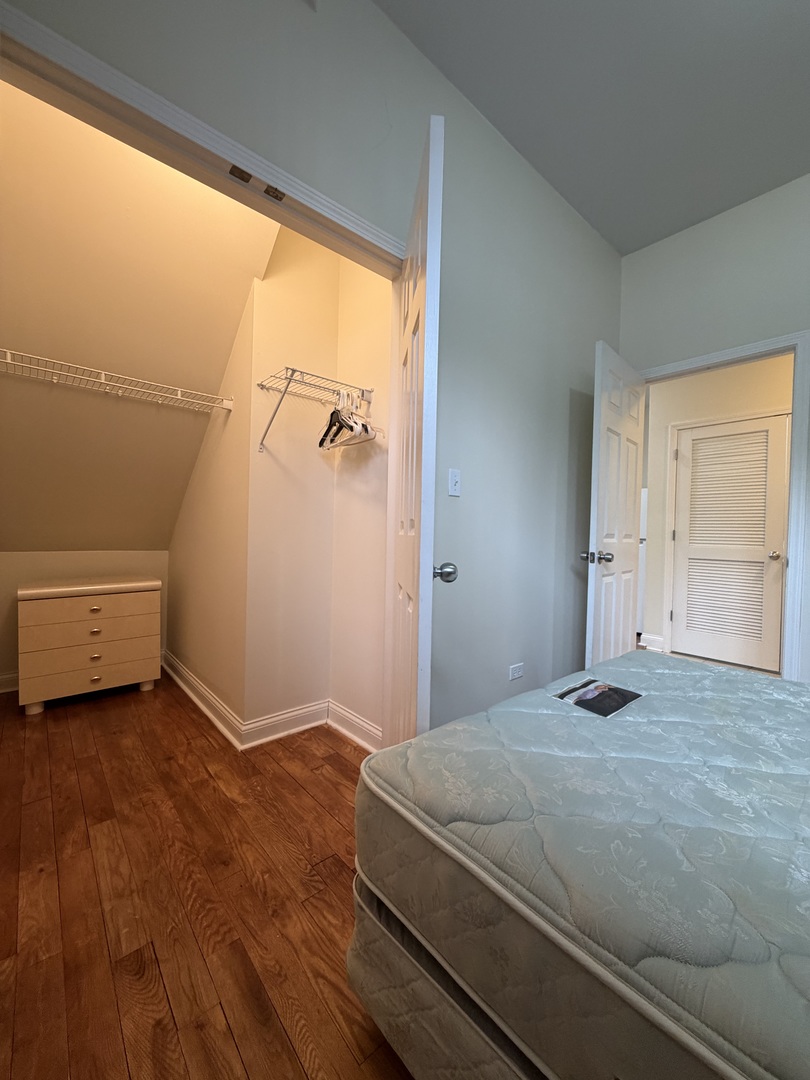 2355 West Harrison Street, Unit GDN Chicago, IL 60612 - Photo 11 of 14 a bedroom with a bed and a window