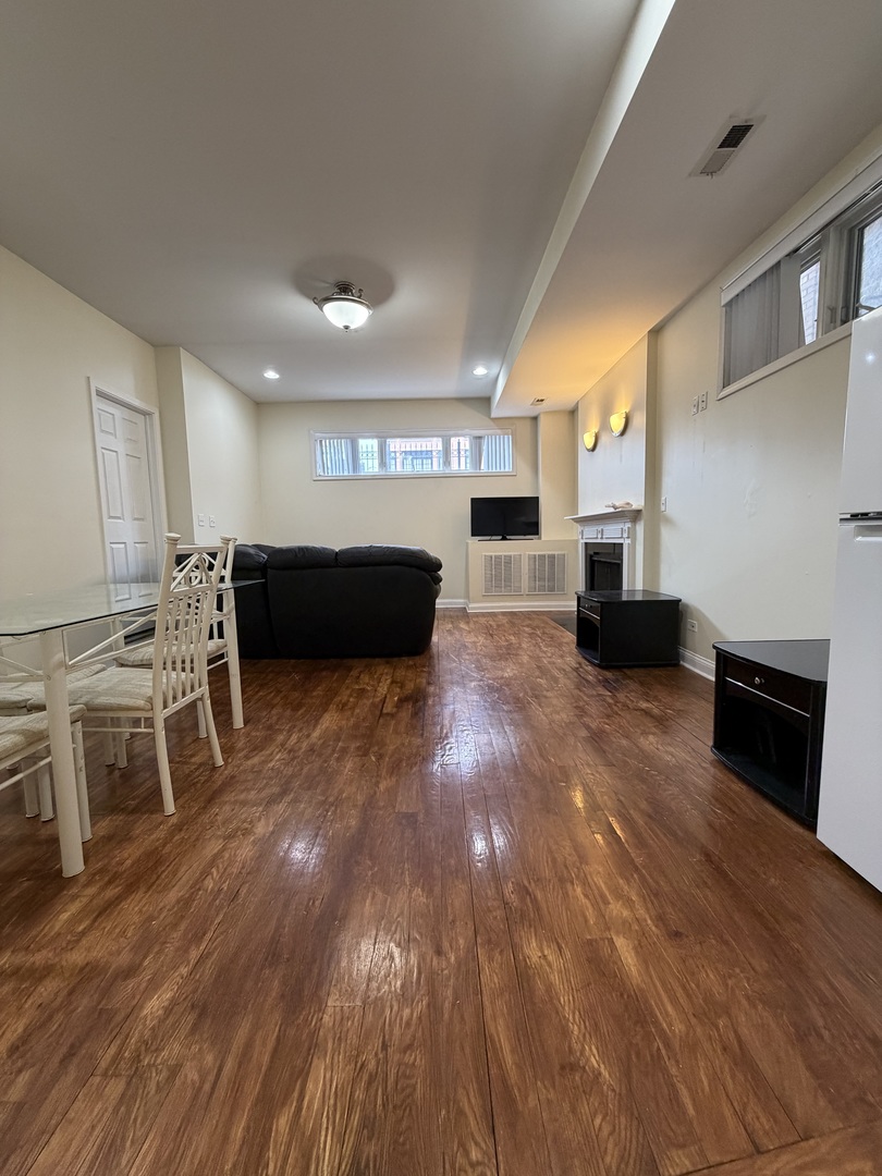 2355 West Harrison Street, Unit GDN Chicago, IL 60612 - Photo 2 of 14 a view of kitchen with furniture and wooden floor