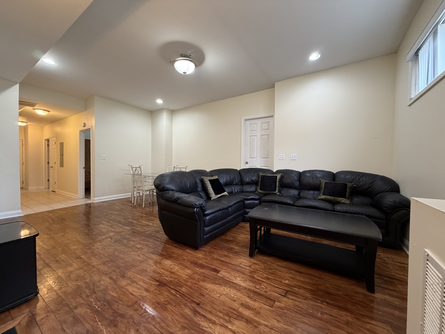 2355 West Harrison Street, Unit GDN Chicago, IL 60612 - Photo 3 of 14 a living room with furniture and a wooden floor