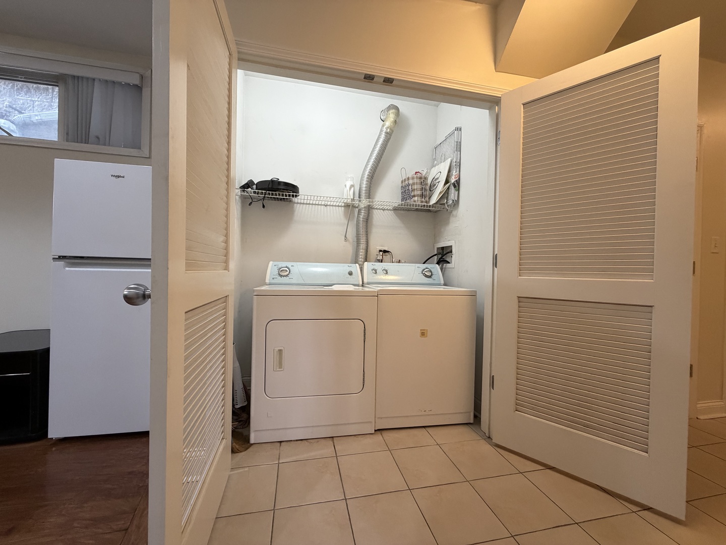 2355 West Harrison Street, Unit GDN Chicago, IL 60612 - Photo 6 of 14 a utility room with cabinets washer and dryer