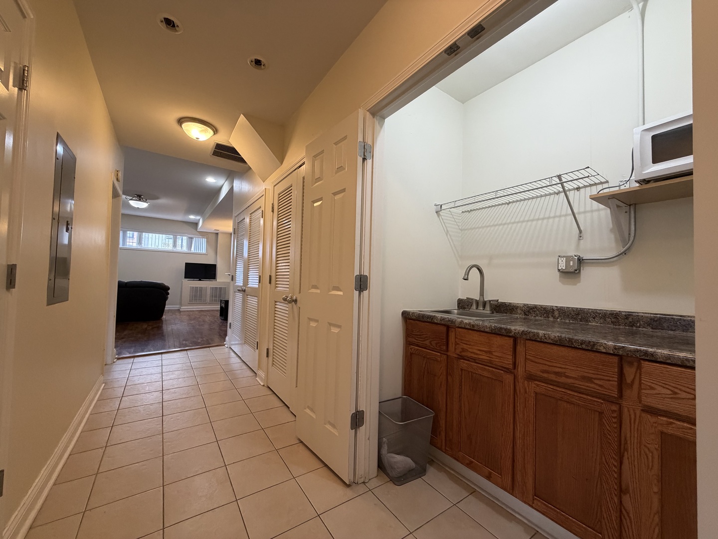 2355 West Harrison Street, Unit GDN Chicago, IL 60612 - Photo 9 of 14 a bathroom with a sink a toilet and mirror