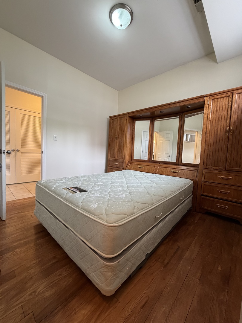 2355 West Harrison Street, Unit GDN Chicago, IL 60612 - Photo 10 of 14 a bedroom with a bed table and a large window