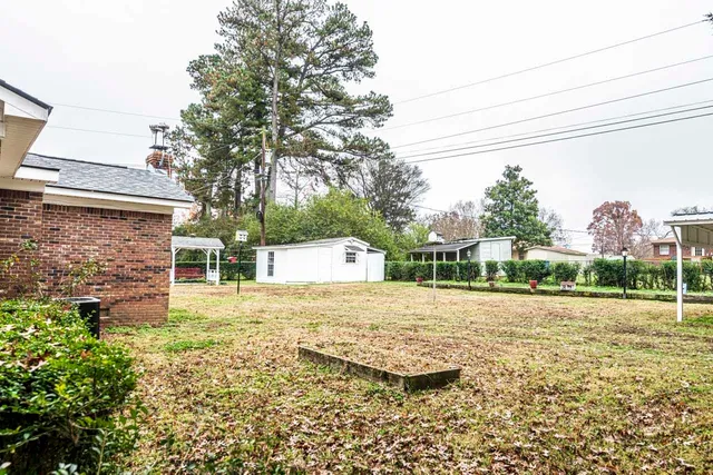 a view of a backyard of the house