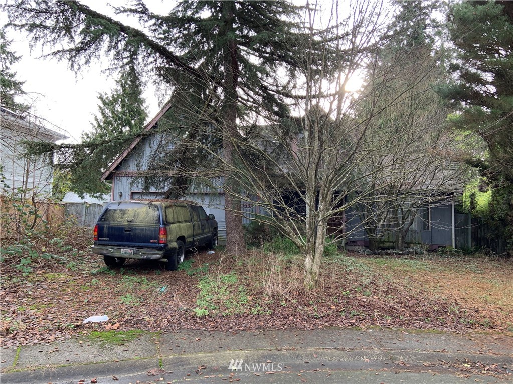 2502 166th Place Southeast Bothell, WA 98012 - Photo 1 of 2 a car parked in front of a house
