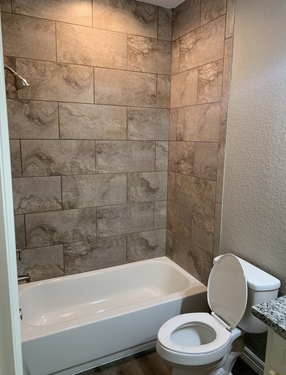 413-415 Hurst Place Angleton, TX 77515 - Photo 15 of 19 a bathroom with a toilet a sink and bathtub