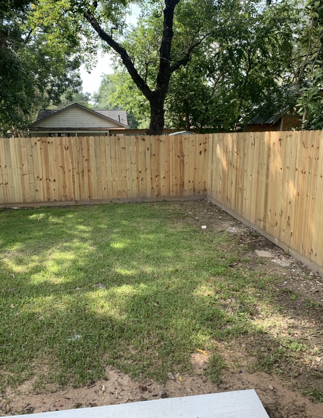413-415 Hurst Place Angleton, TX 77515 - Photo 16 of 19 a view of a backyard