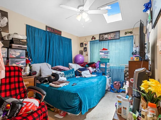 a bed room with furniture and a window