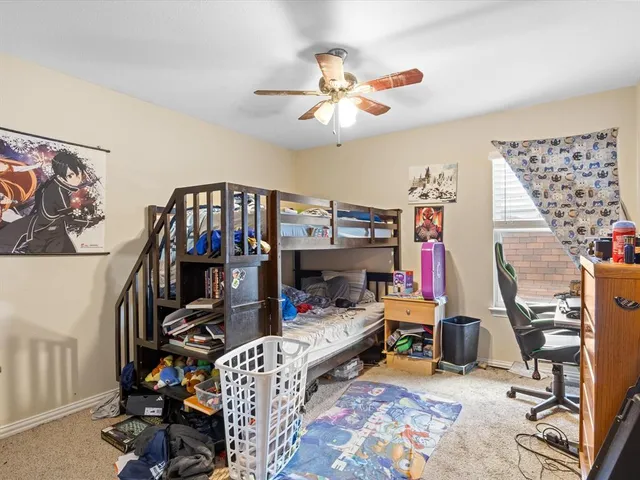 a bed room with a bed and a book shelf