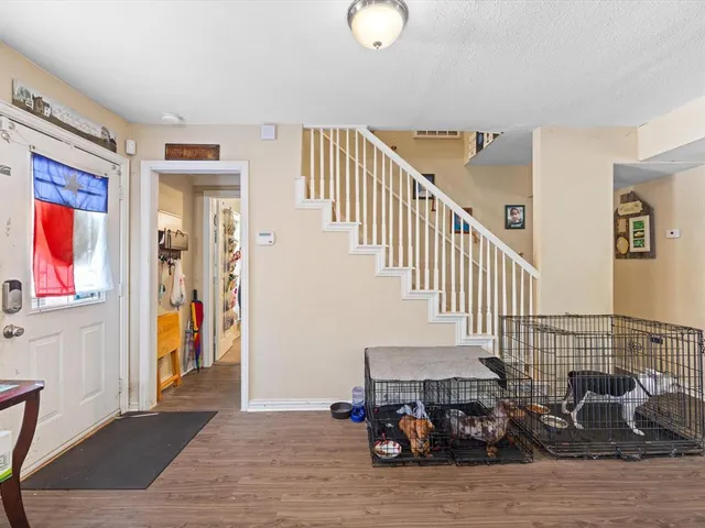 a view of a livingroom with furniture and staircase