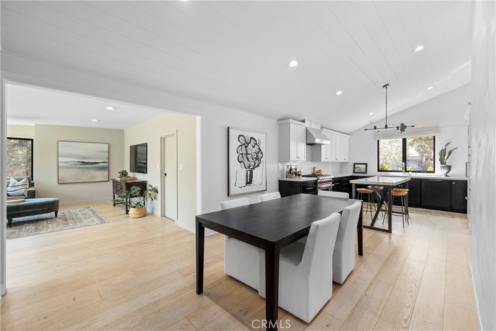338 Bucknell Road Costa Mesa, CA 92626 - Photo 11 of 25 a living room with stainless steel appliances kitchen island a table and chairs in it