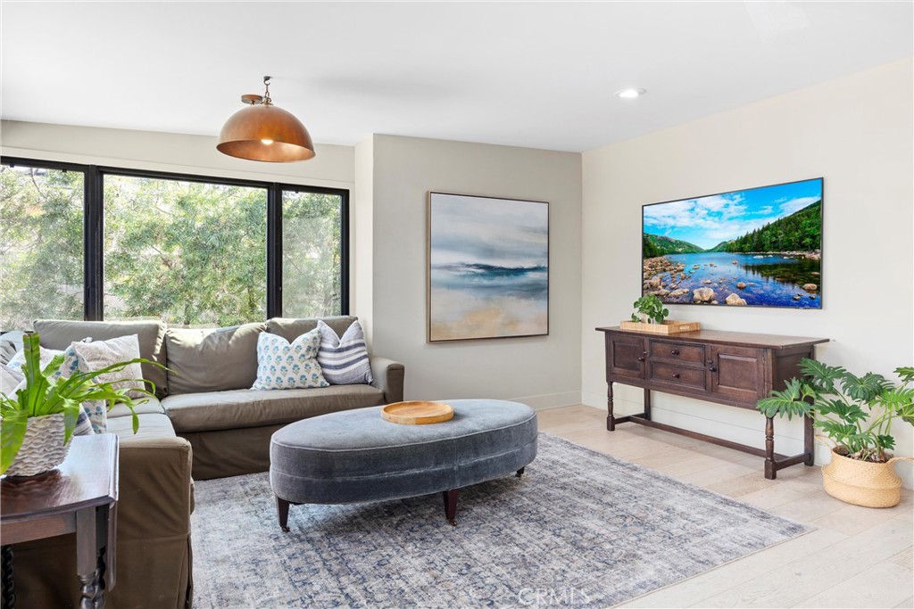338 Bucknell Road Costa Mesa, CA 92626 - Photo 13 of 25 a living room with furniture a flat screen tv and a large window
