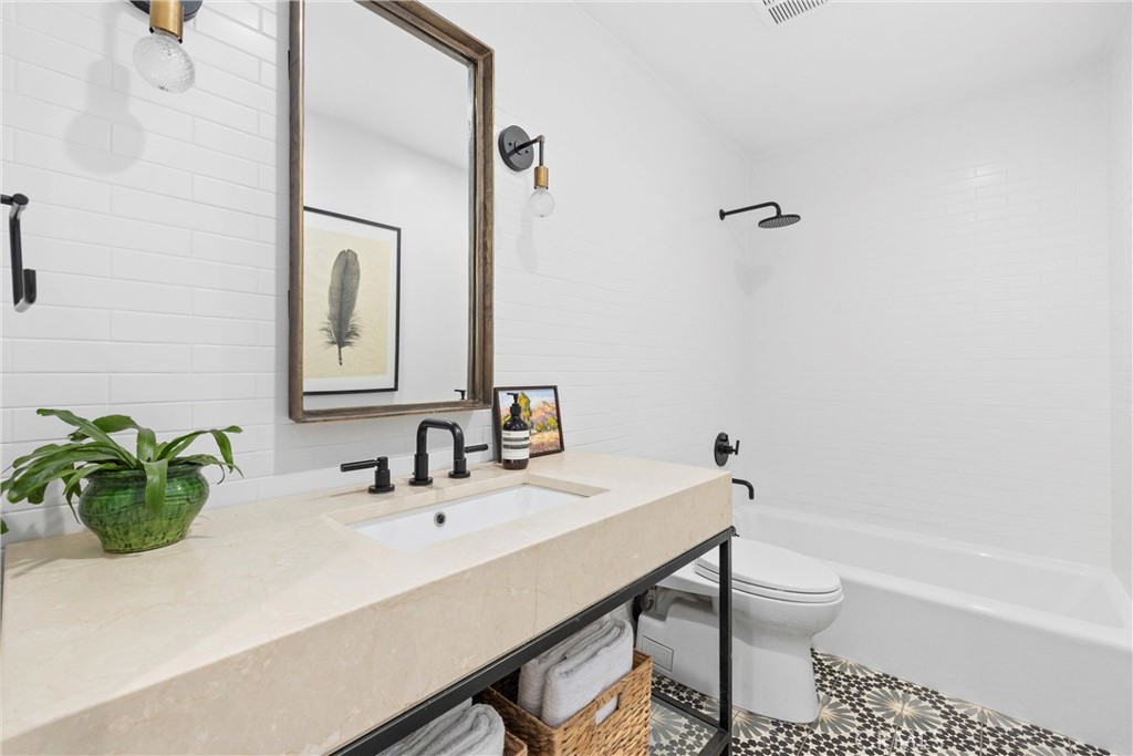 338 Bucknell Road Costa Mesa, CA 92626 - Photo 14 of 25 a bathroom with a sink a toilet and shower