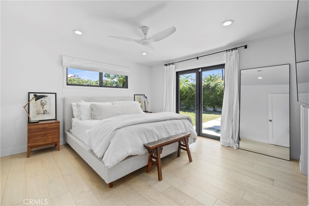 338 Bucknell Road Costa Mesa, CA 92626 - Photo 20 of 25 a spacious bedroom with a bed and a large window