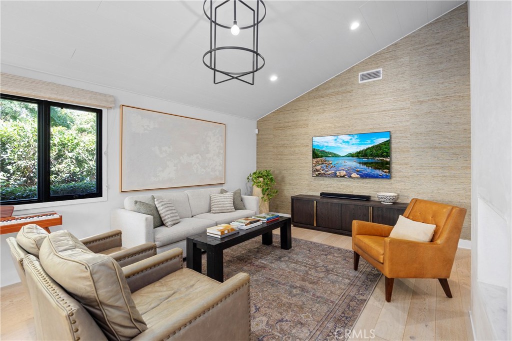 338 Bucknell Road Costa Mesa, CA 92626 - Photo 3 of 25 a living room with furniture a large window and a flat screen tv
