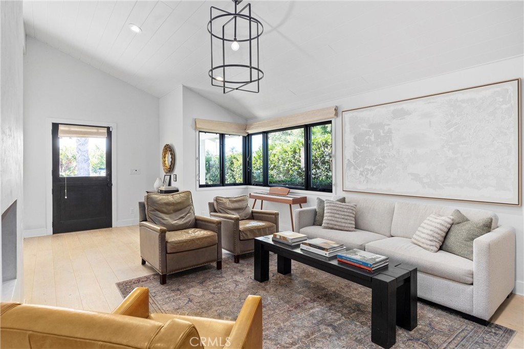 338 Bucknell Road Costa Mesa, CA 92626 - Photo 4 of 25 a living room with furniture ceiling fan and a rug