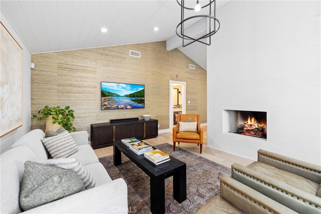 338 Bucknell Road Costa Mesa, CA 92626 - Photo 5 of 25 a living room with furniture a rug and a flat screen tv