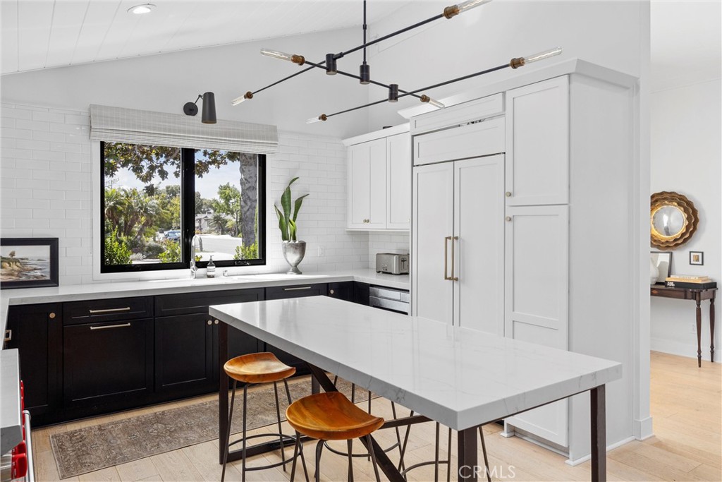338 Bucknell Road Costa Mesa, CA 92626 - Photo 6 of 25 a kitchen with stainless steel appliances granite countertop a sink a stove and a refrigerator