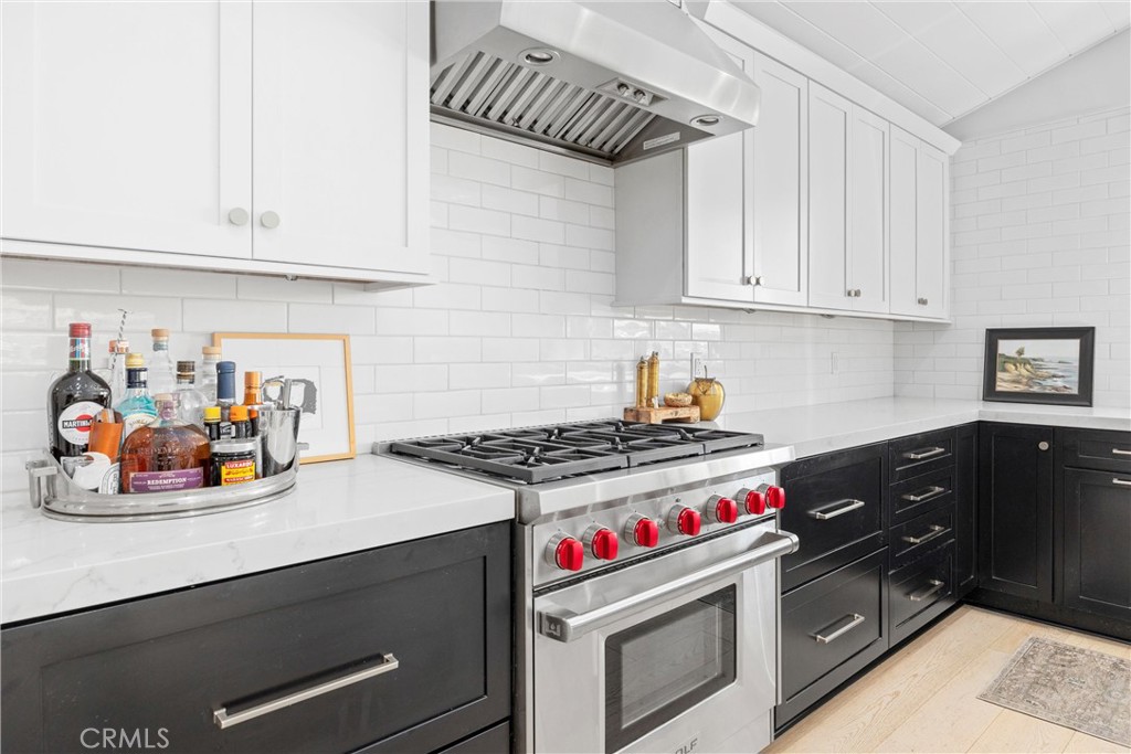 338 Bucknell Road Costa Mesa, CA 92626 - Photo 9 of 25 a kitchen with a stove and cabinets