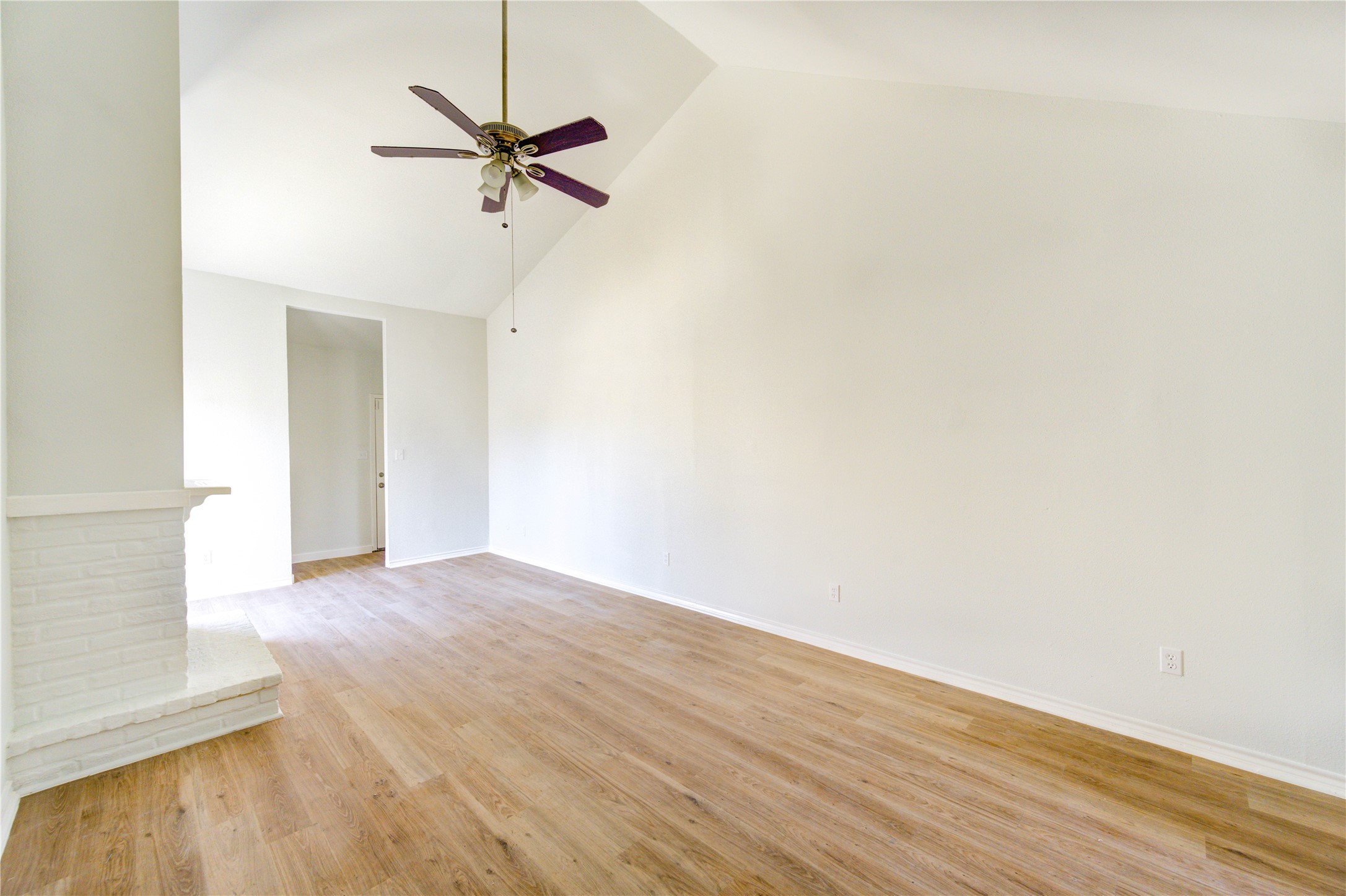 6401 Deihl Road, Unit 505 Houston, TX 77092 - Photo 13 of 35 a view of a room with wooden floor and a ceiling fan