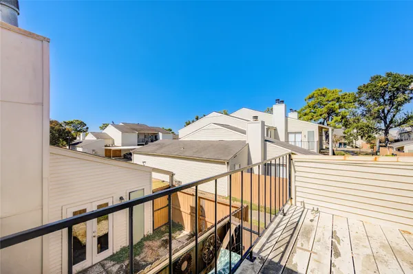 a view of a balcony with furniture