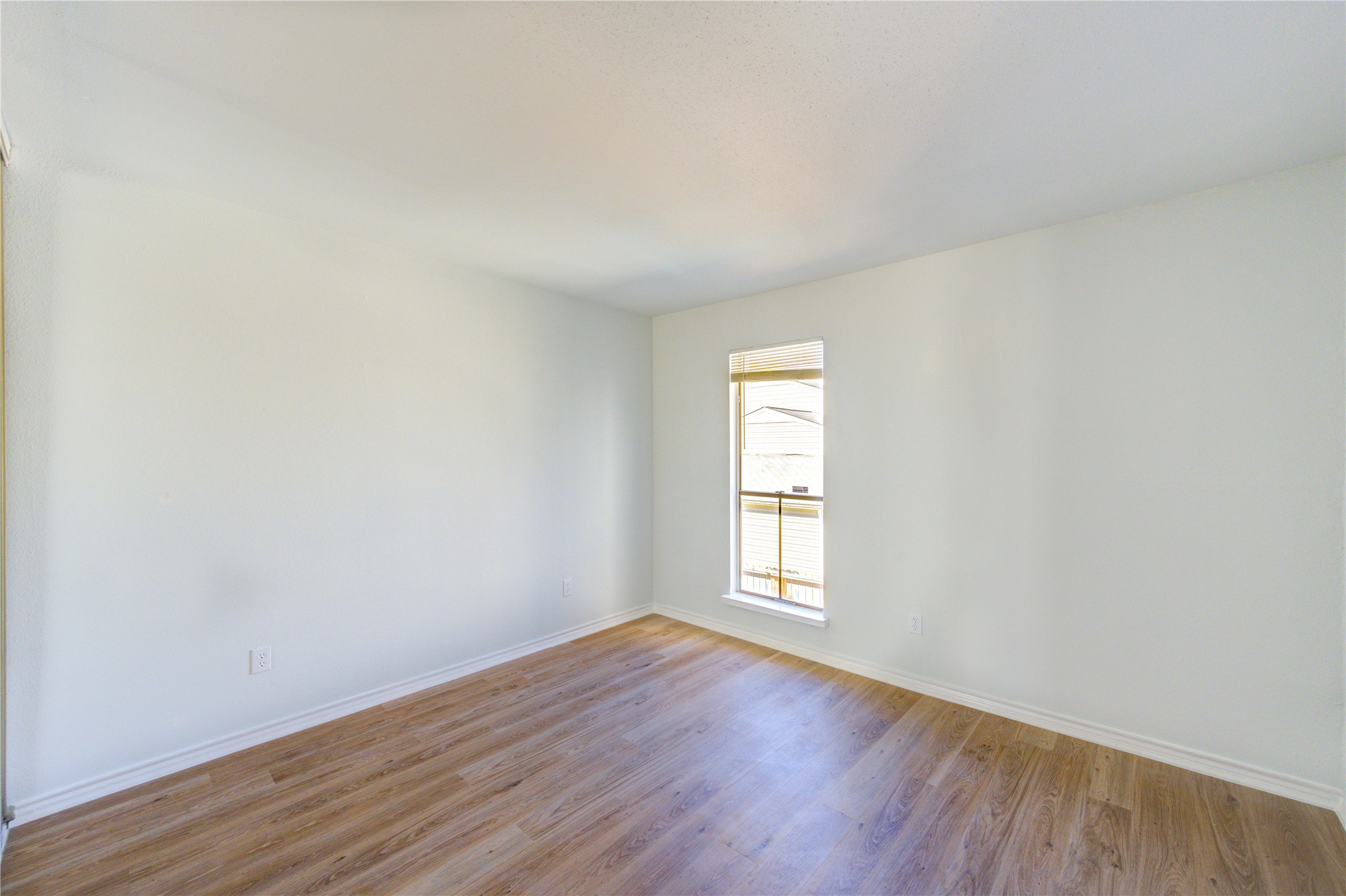 6401 Deihl Road, Unit 505 Houston, TX 77092 - Photo 20 of 35 an empty room with wooden floor and window