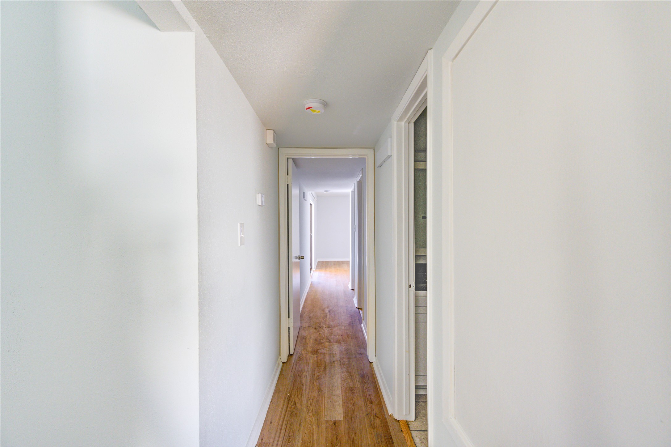 6401 Deihl Road, Unit 505 Houston, TX 77092 - Photo 22 of 35 a view of hallway with wooden floor