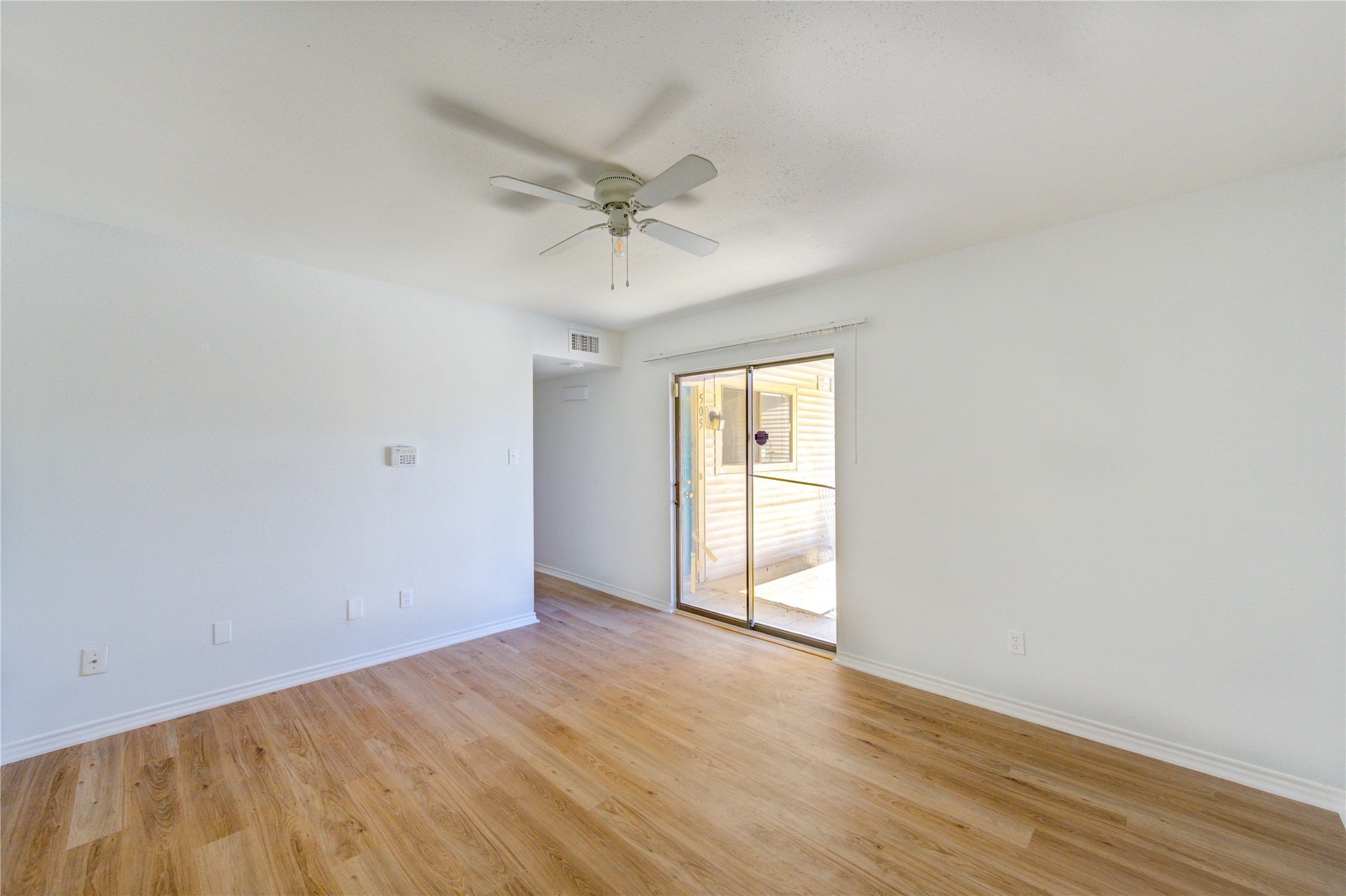 6401 Deihl Road, Unit 505 Houston, TX 77092 - Photo 24 of 35 a view of empty room with wooden floor and fan